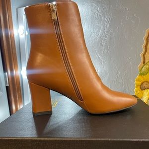 Brand new brown booties, they didn’t fit and could no longer return.